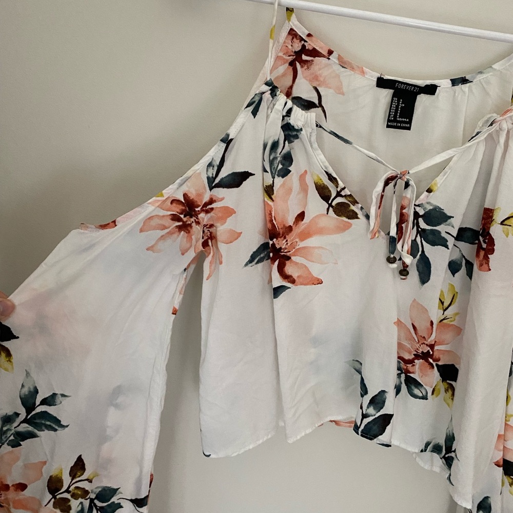 Shoulder cut out flowery top
